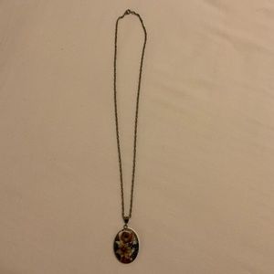 Silver necklace w/glass pendant of painted flowers